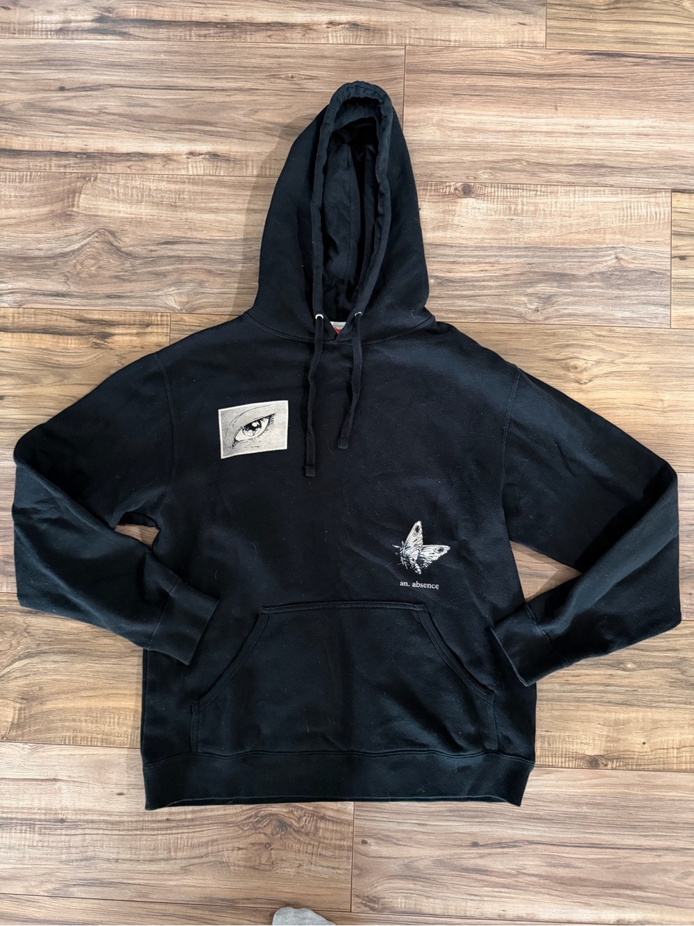 OMOCAT Black Hoodie with Eye and Butterfly Graphics